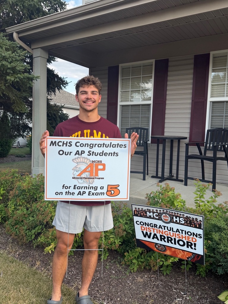Student in yard with AP sign