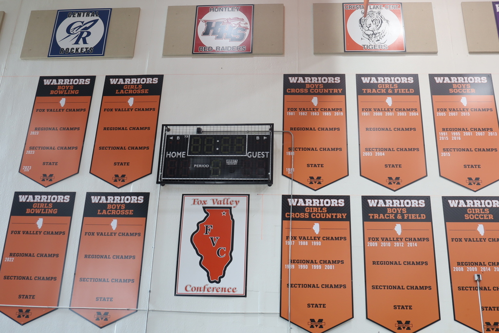 Banners in Upper campus gym Fox Valley Champs, Regional champs, sectional champs celebrations