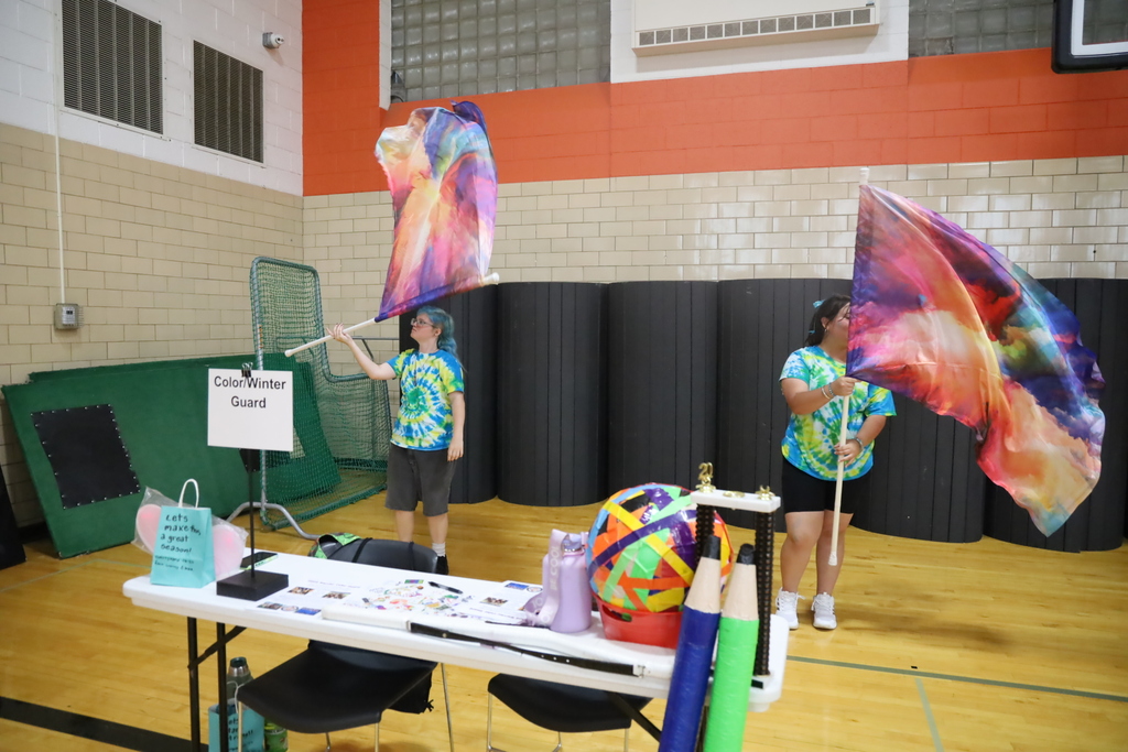 Color guard with flags at a color winter guard booth