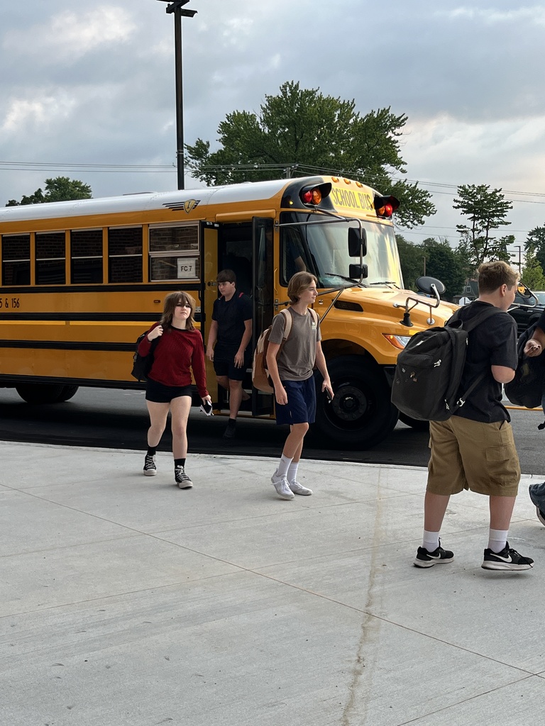 Students walking off the bus