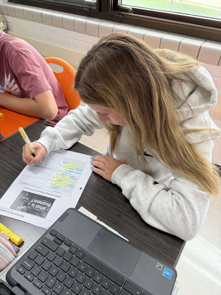 Students working on focused note-taking in Mrs. Harris' Intro to Business class