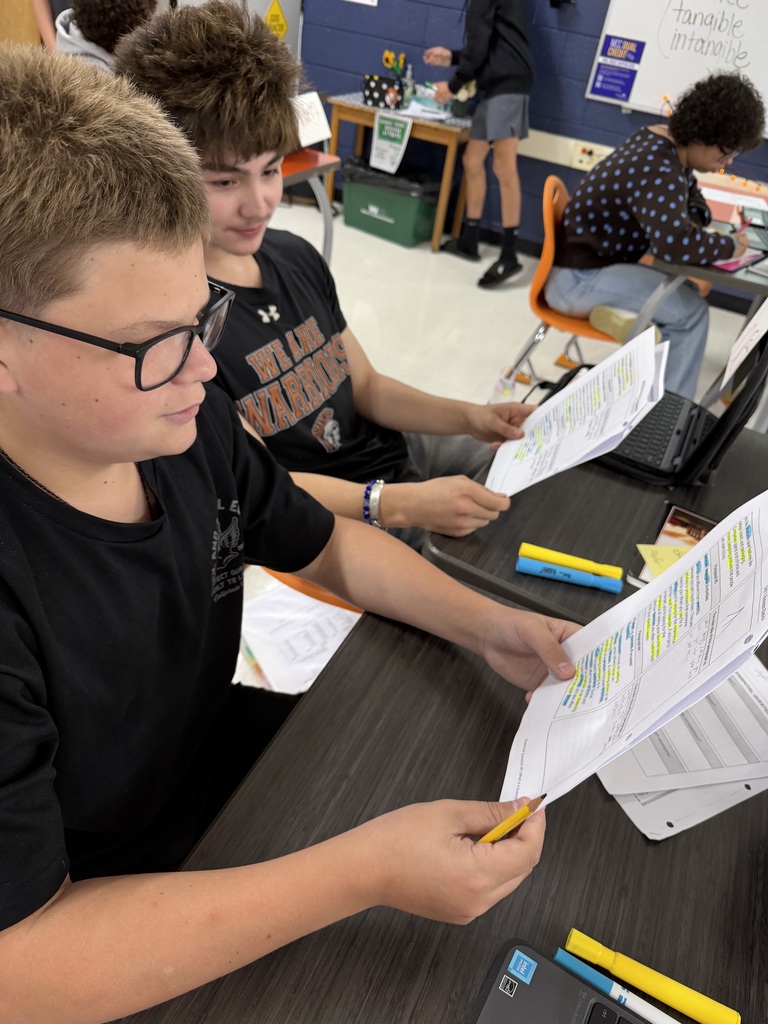 Students working on focused note-taking in Mrs. Harris' Intro to Business class