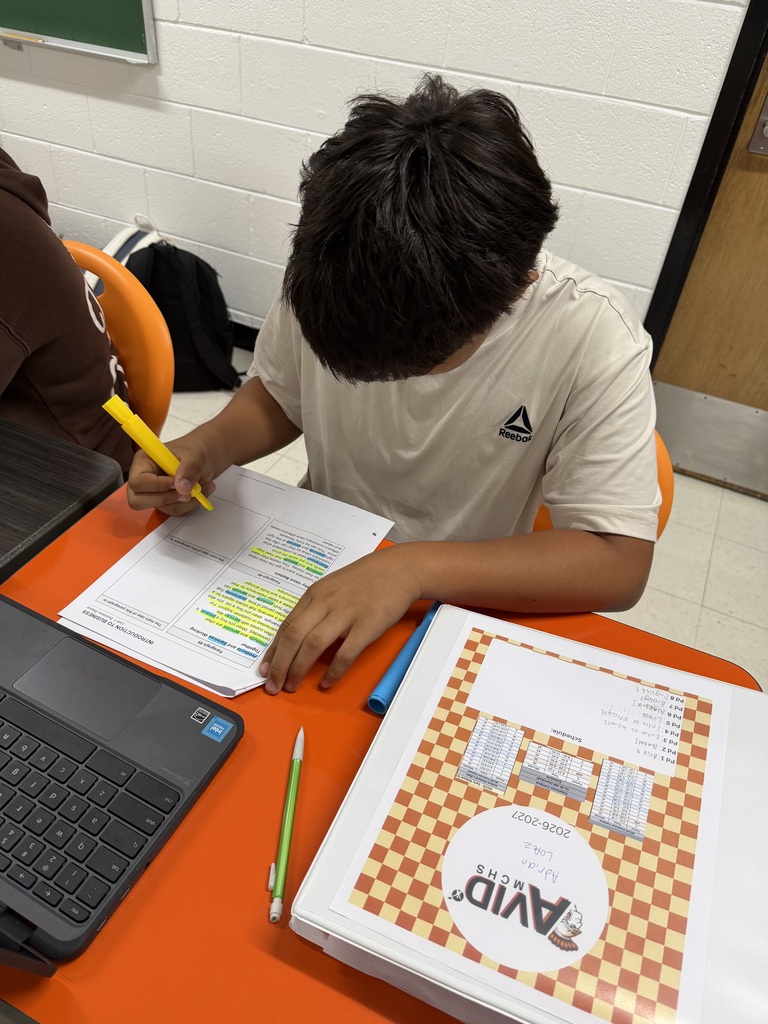 Students working on focused note-taking in Mrs. Harris' Intro to Business class