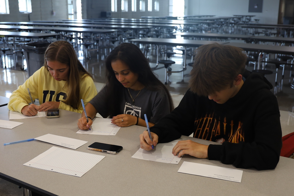 Students writing letters