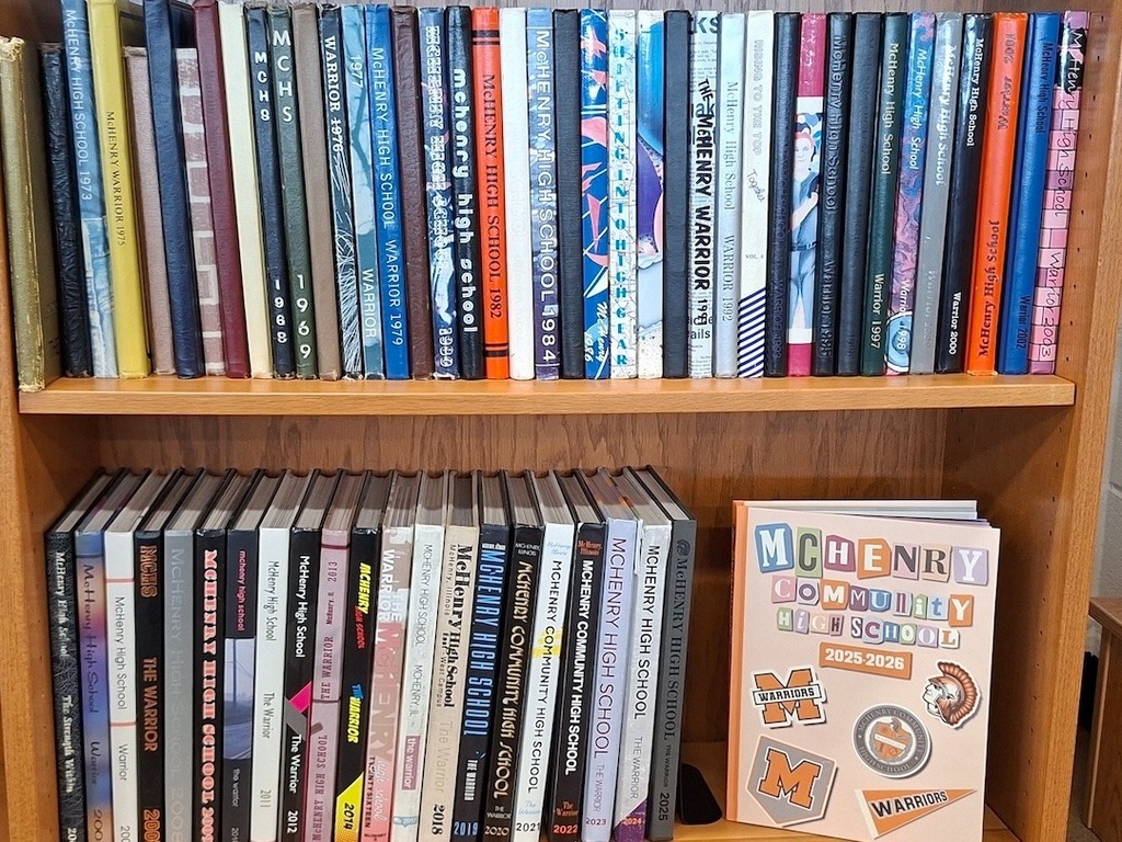 Bookcase with MCHS yearbooks, including the newest 2025-2026 book