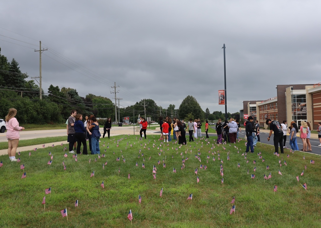 Students around the American flags