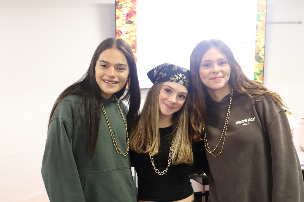 Students with gold beads