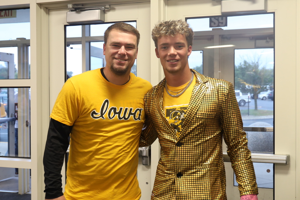 Student and teacher in gold spirit outfits