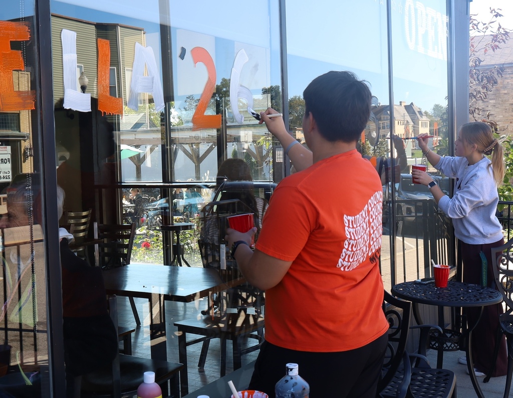 Students painting windows