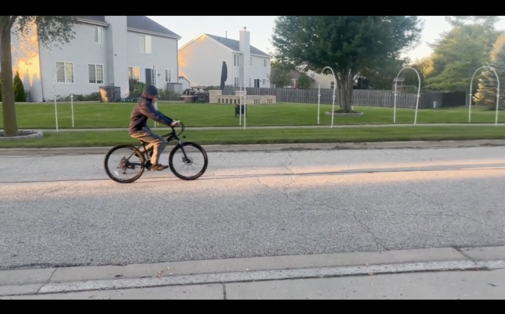 Someone riding an e-bike on the road