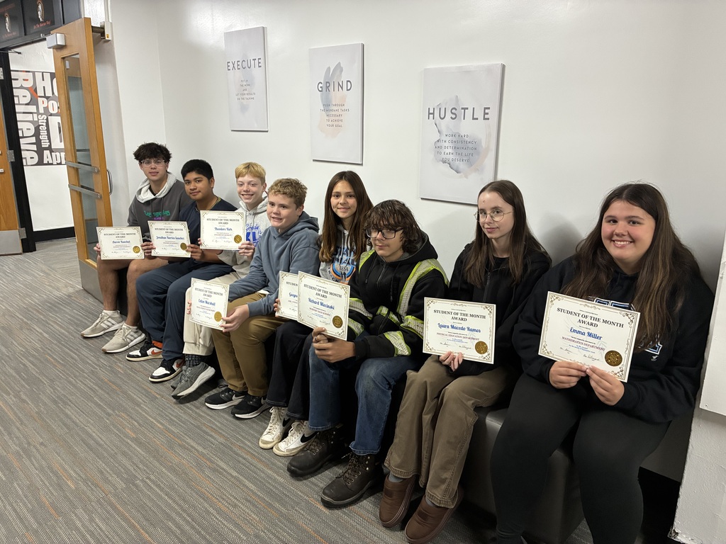 Eight students holding certificates