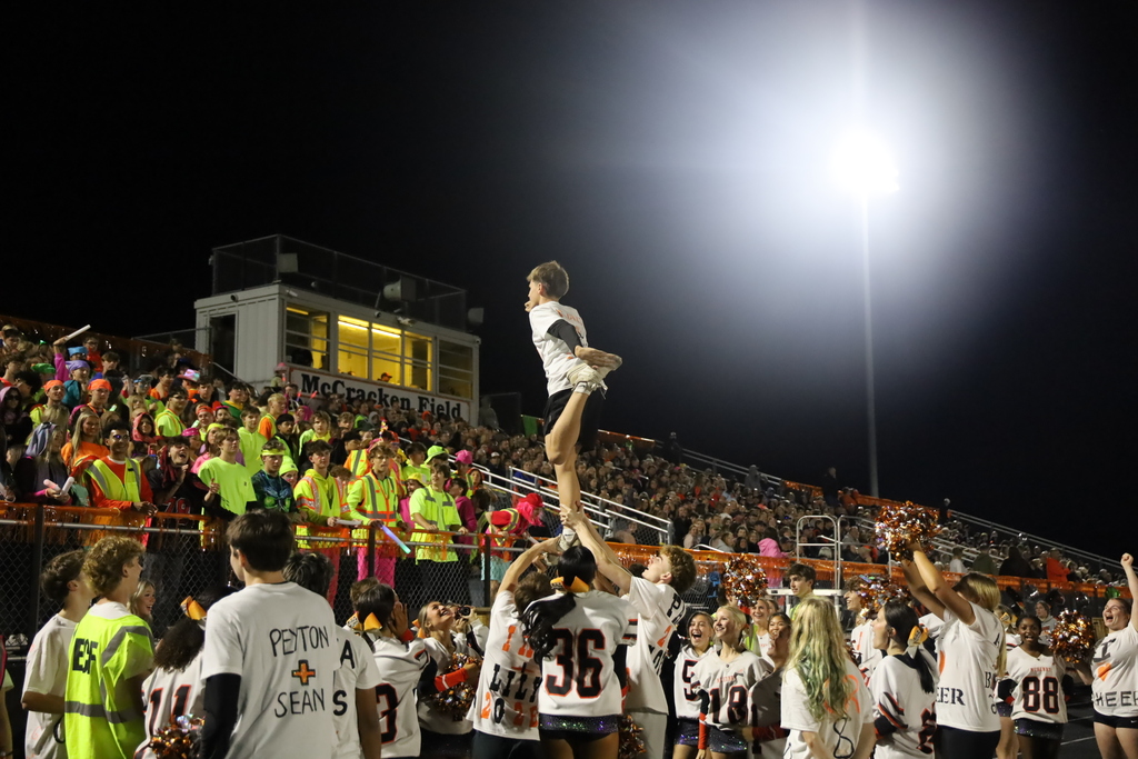 Boy doing cheer stunt 