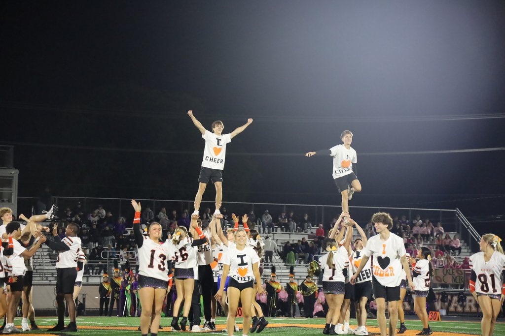 Cheer stunt holding up partners