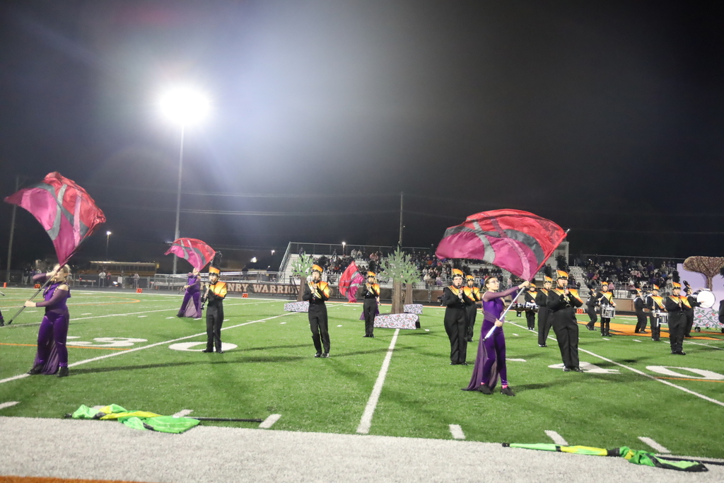 Marching band on field with color guard