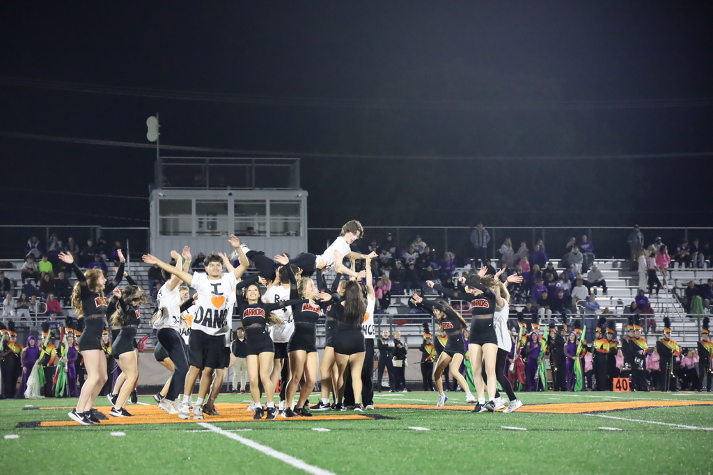 Dance with partners, group holding up one