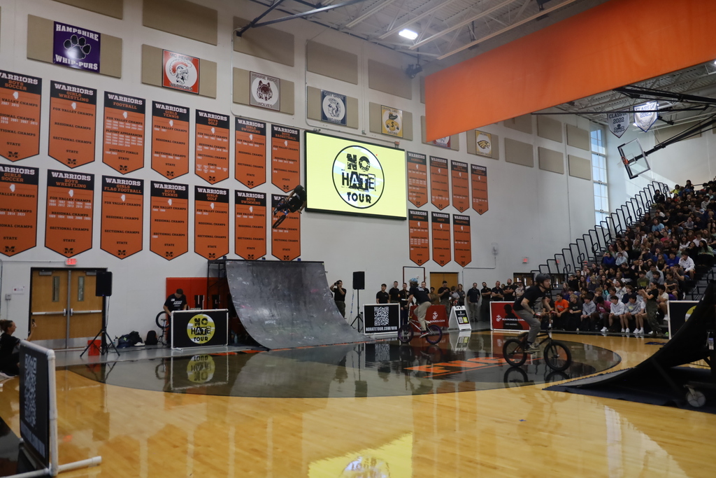 Bikers on ramps with NO Hate Tour Sign