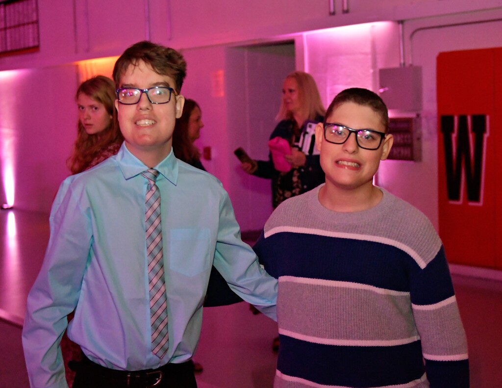Two students posing on dance floor