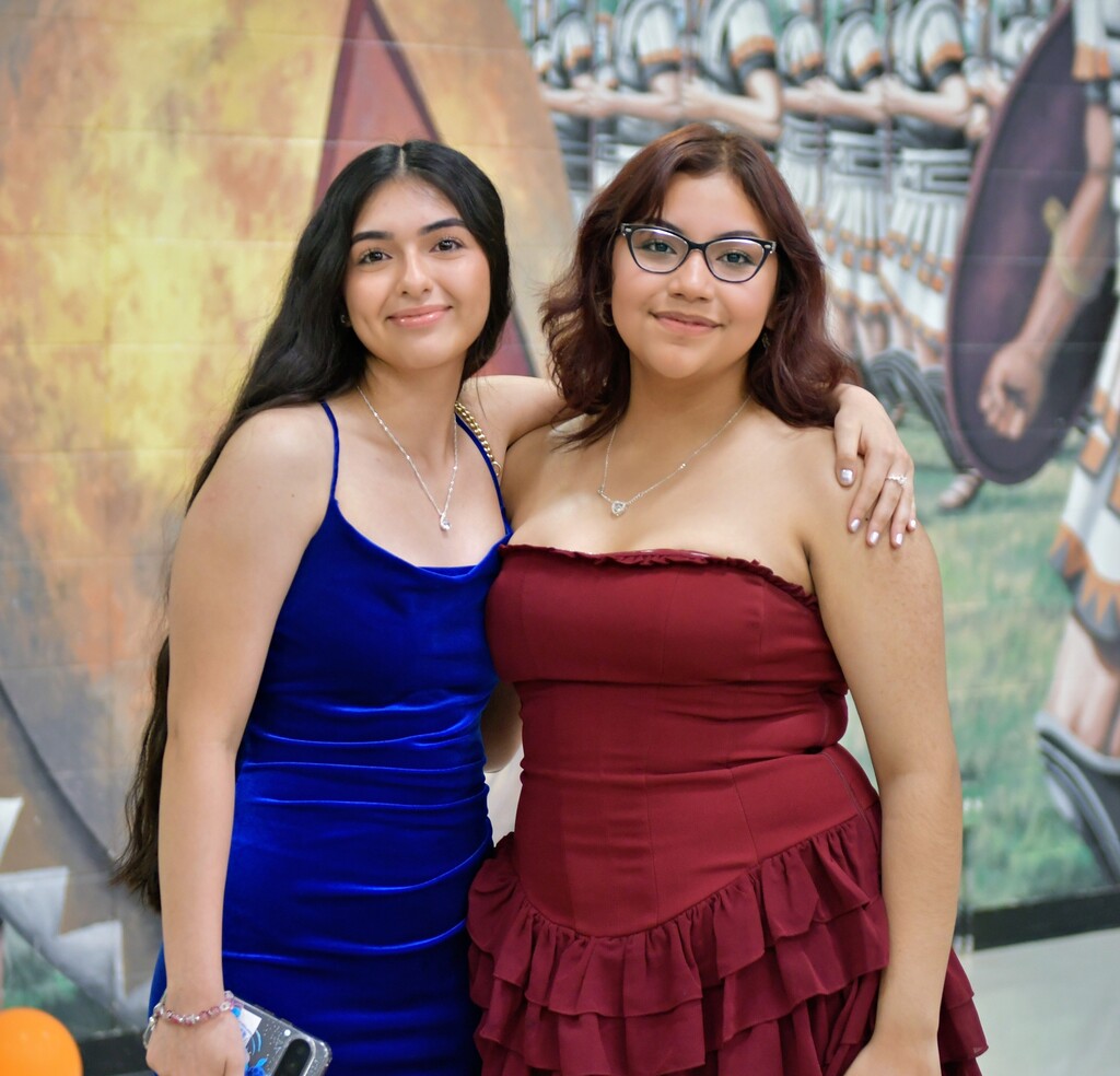 Two students posing in the hallway