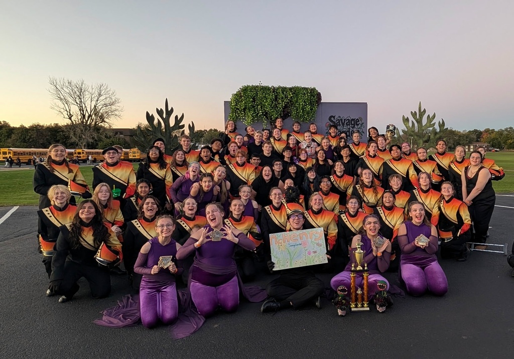 Band with trophy and sign that says McHenry with hand-drawn flowers