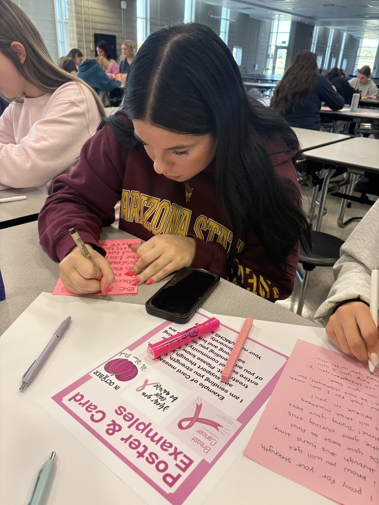 Student writing a card