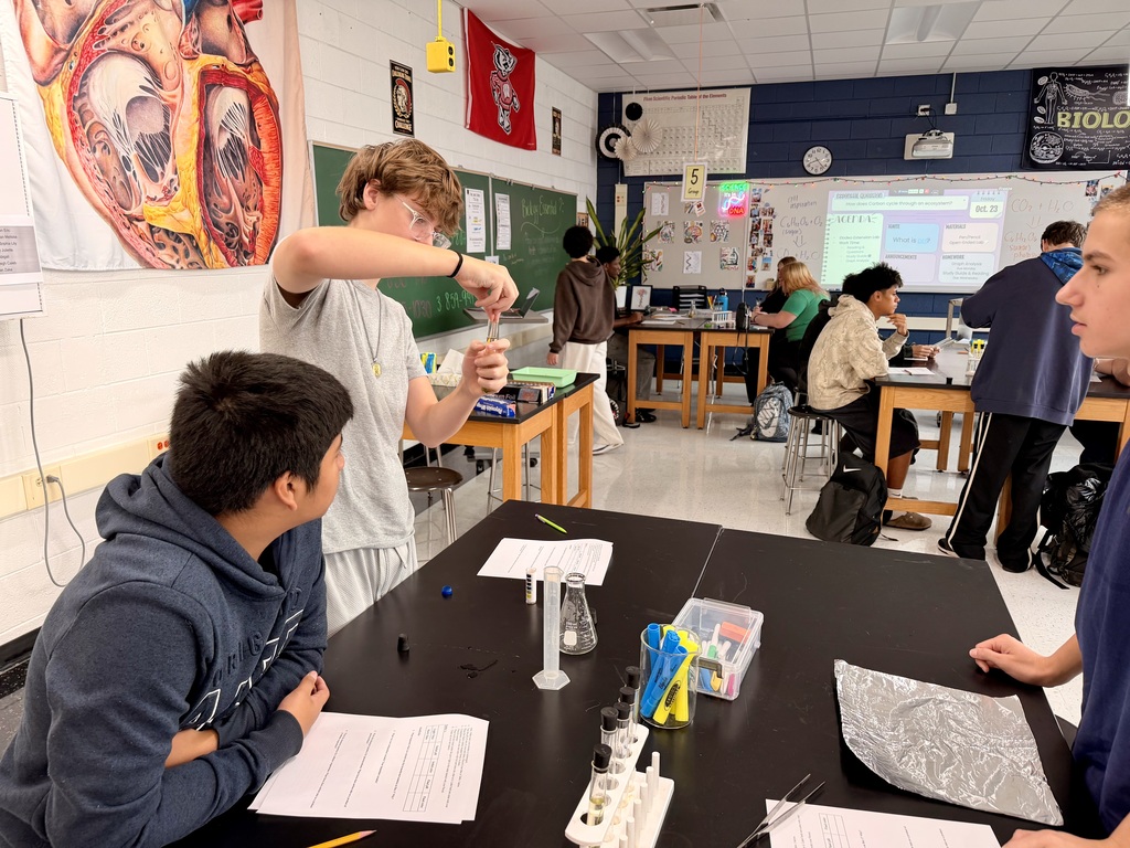Student holding beaker