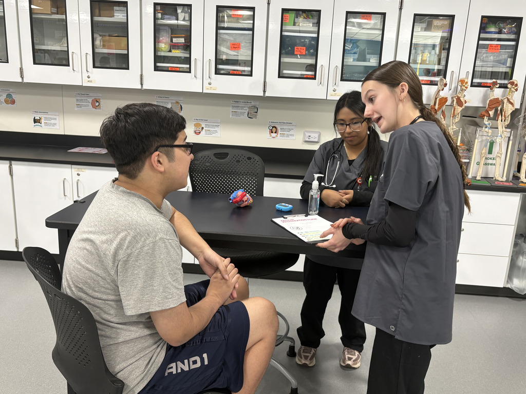Student talking to their practice patient