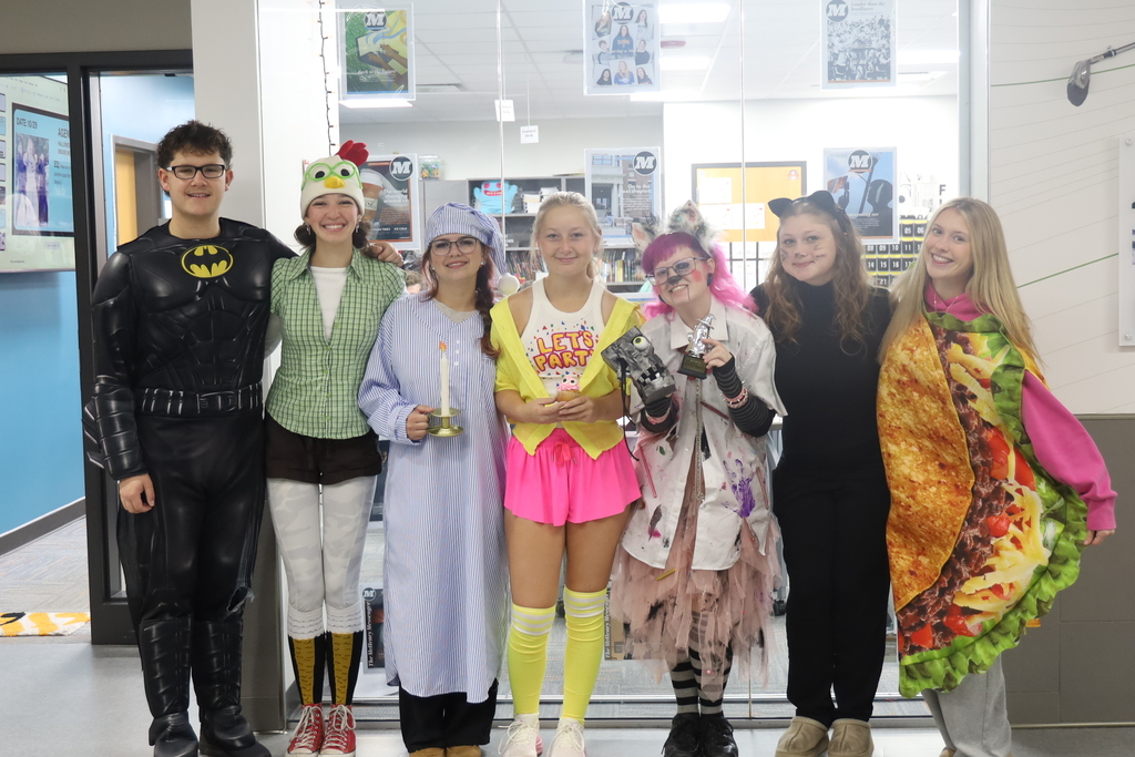Students in Halloween costumes, Batman, chicken, Scrooge, Let's Party Five nights at freddys, lab coat tutu costume with bunny ears, cat and taco