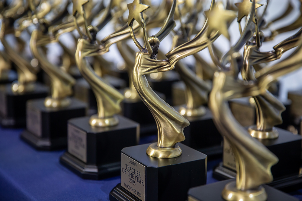 row of trophies on table