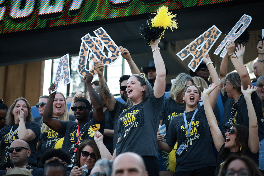 teachers from RJE cheering in the stands