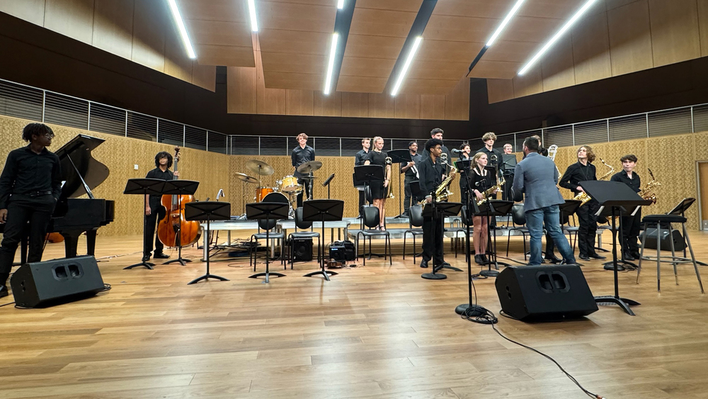 group on stage before performance at Apex Jazz Festival in McKinney