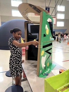 Student with Cardboard Challenge Game