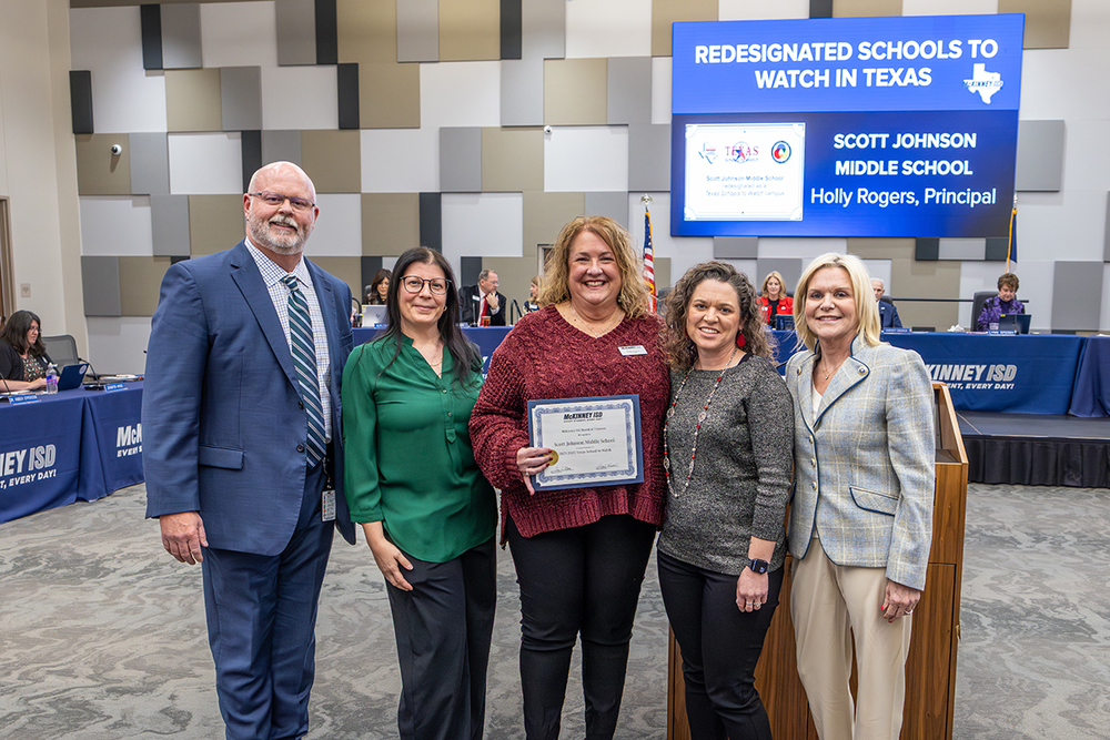 Principal Holly Rogers and members of SJMS staff with Superintendent Shawn Pratt and Deputy Superintendent Melanie Raleeh