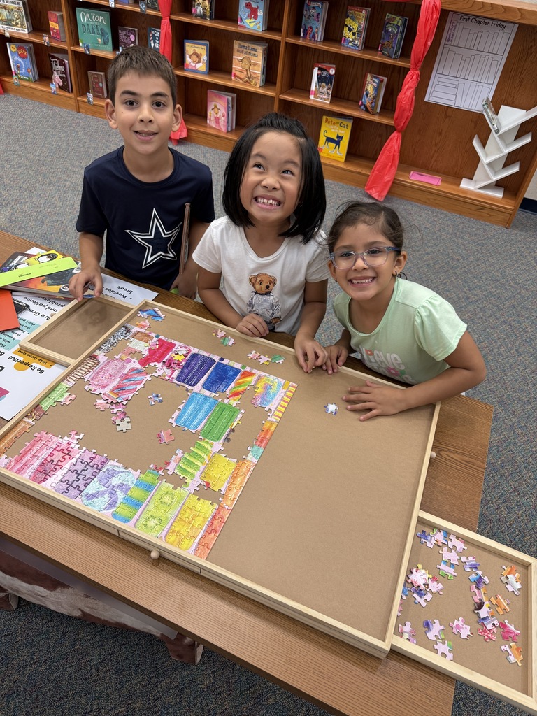 2nd graders working on the puzzle