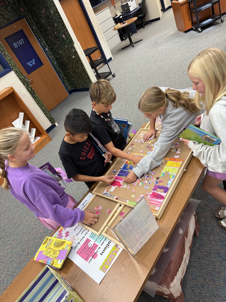 5th graders working on the puzzle.