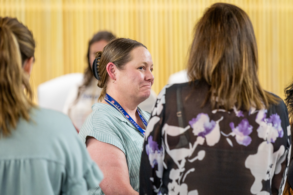 female participants standing and talking