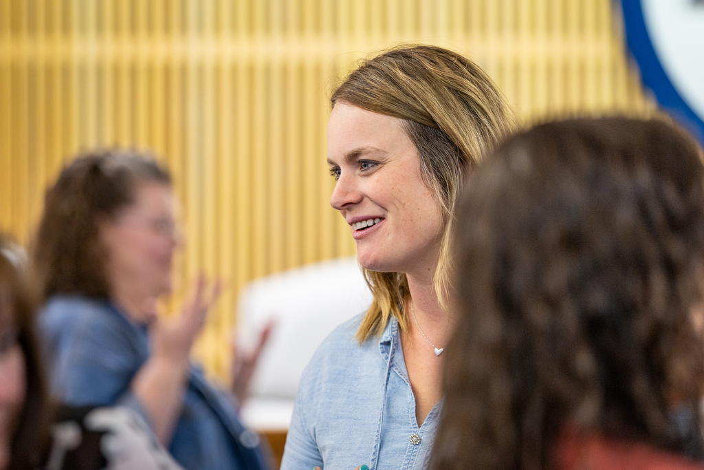 female participant standing and talking