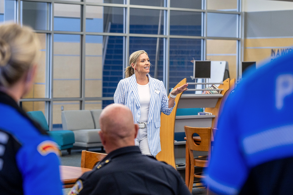 Principal Jenny Zornes speaks to the firefighters and police officers, welcoming them to Cockrill