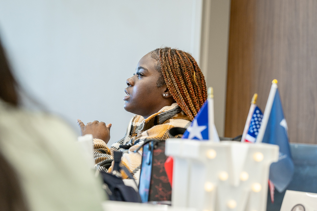 female student seated and talking