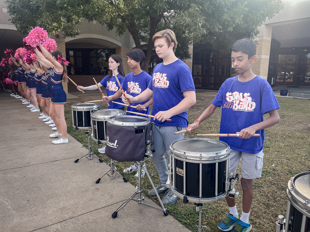 members of the drum line performing as guests arrive