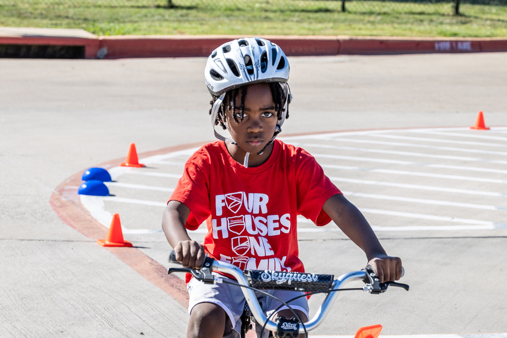 boy on bike riding toward camera