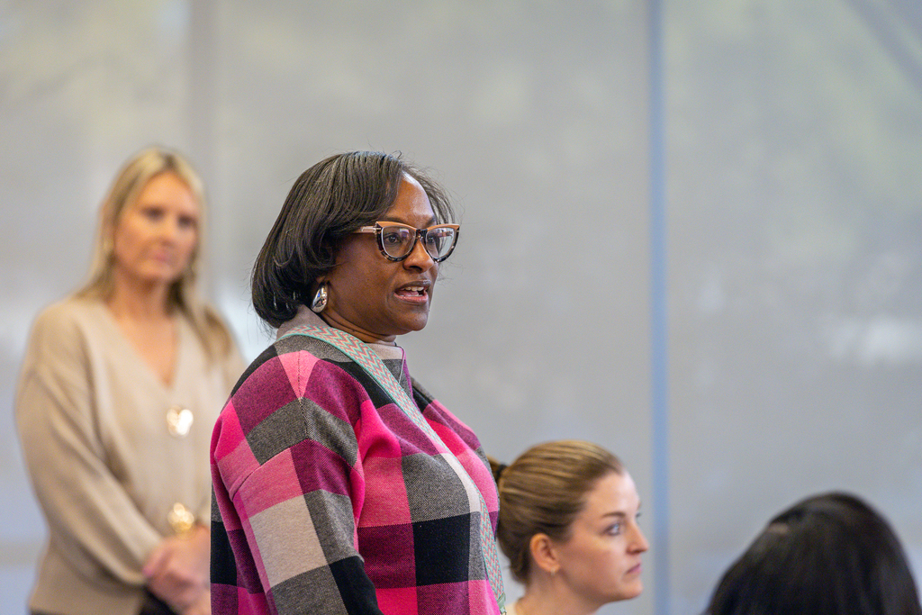 female participant standing and talking
