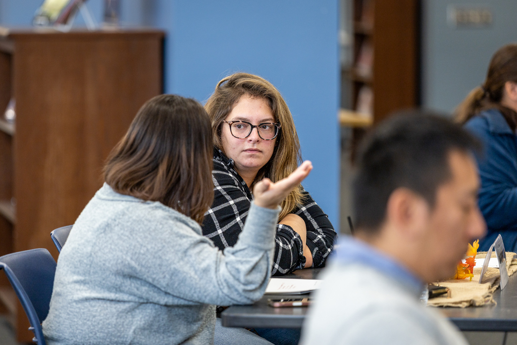 two women talking at their table
