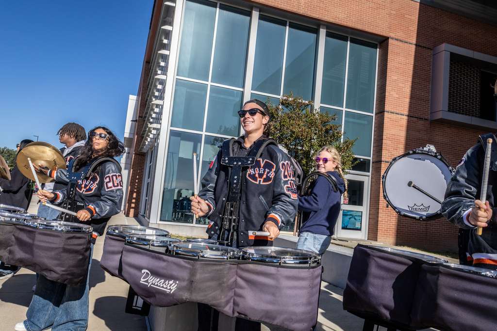 drum line members playing in front of McKinney North