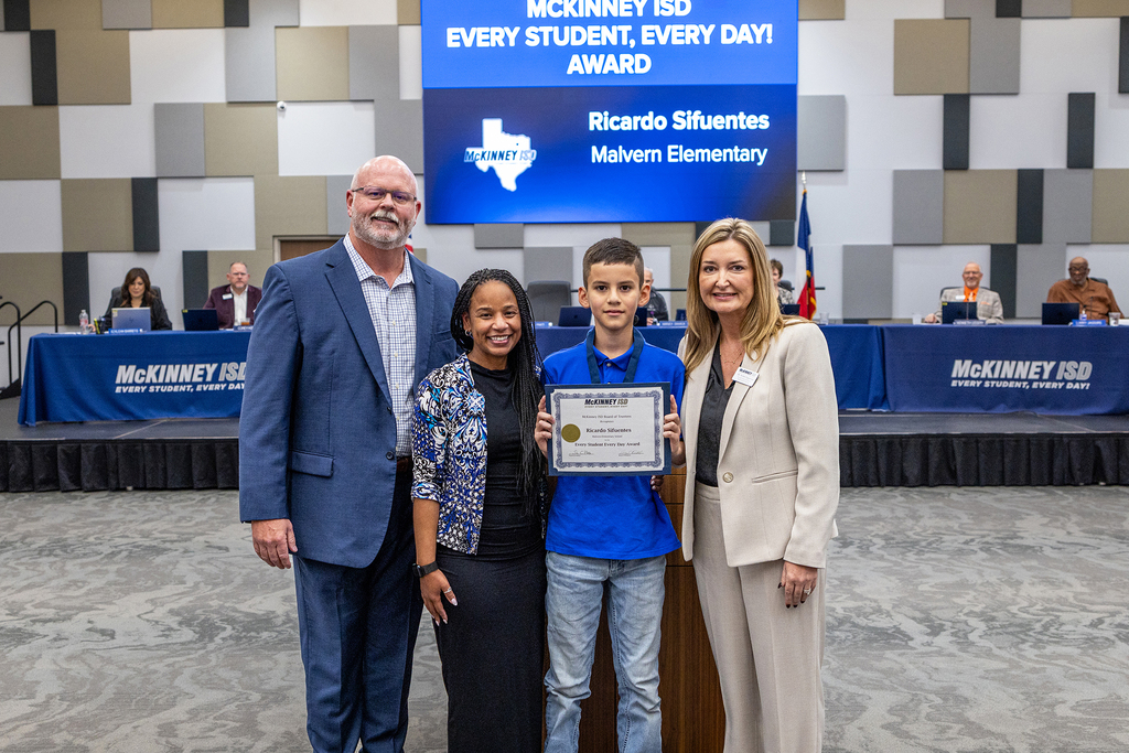 Ricardo Sifuentes with certificate at board meeting