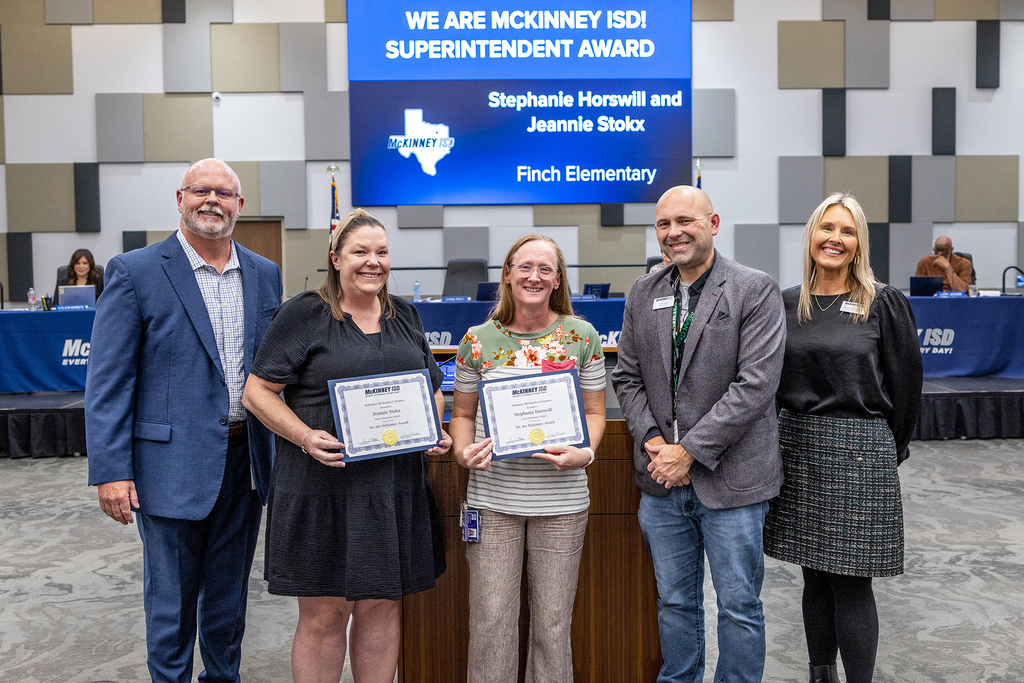Stephanie Horswill and Jeannie Stokx with certificates at board meeting