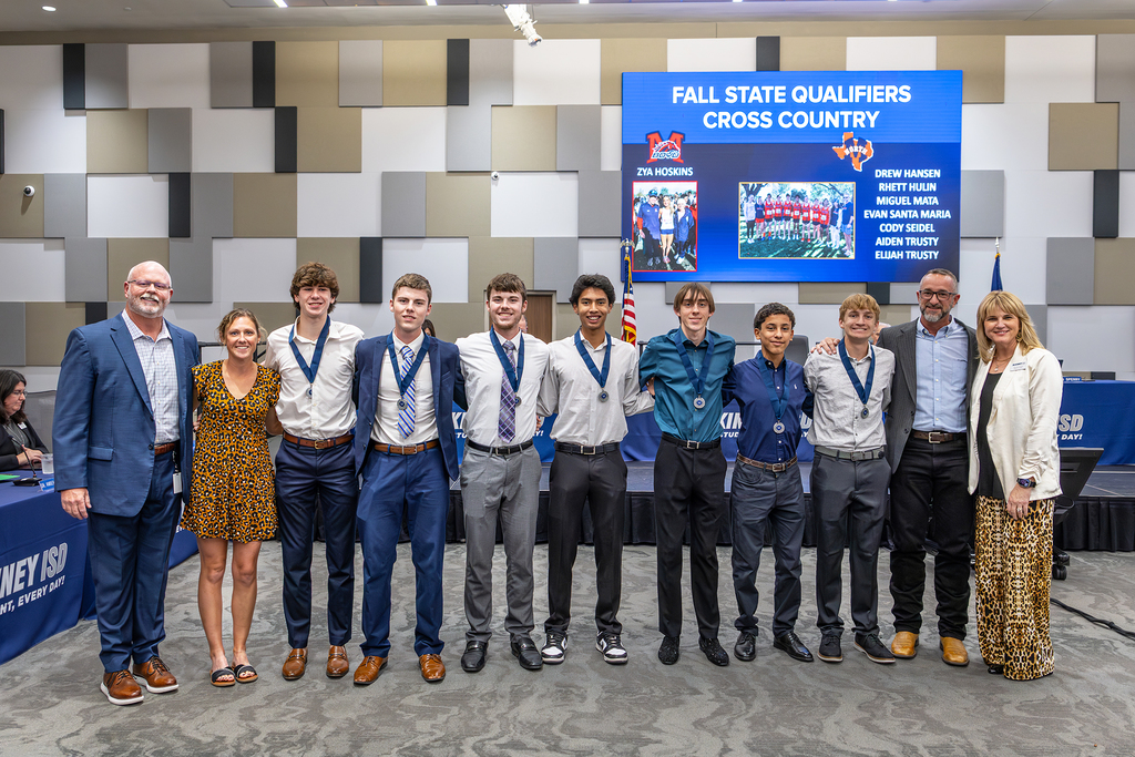 athletes standing together at board meeting