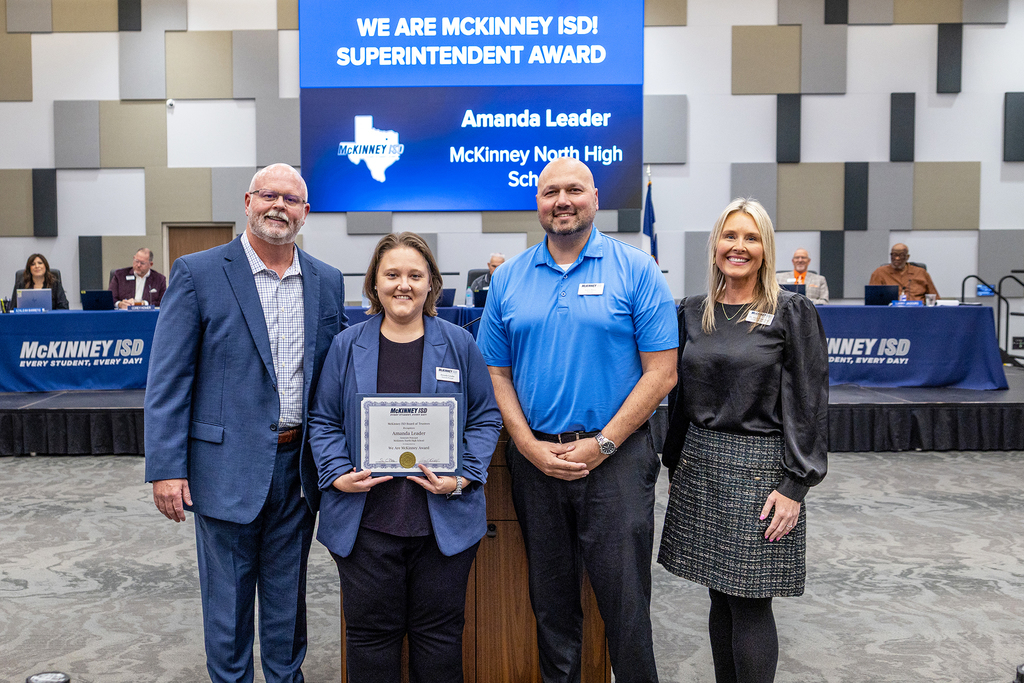 Amanda Leader with certificate at board meeting