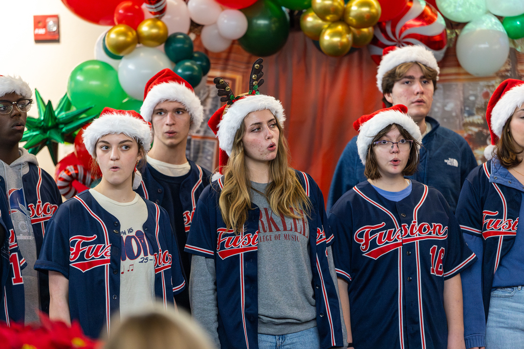 male and female singers performing in double lines