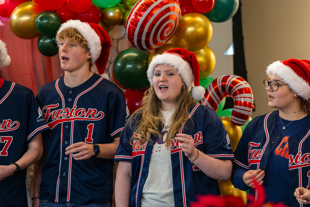 male and female singers snapping while they sing