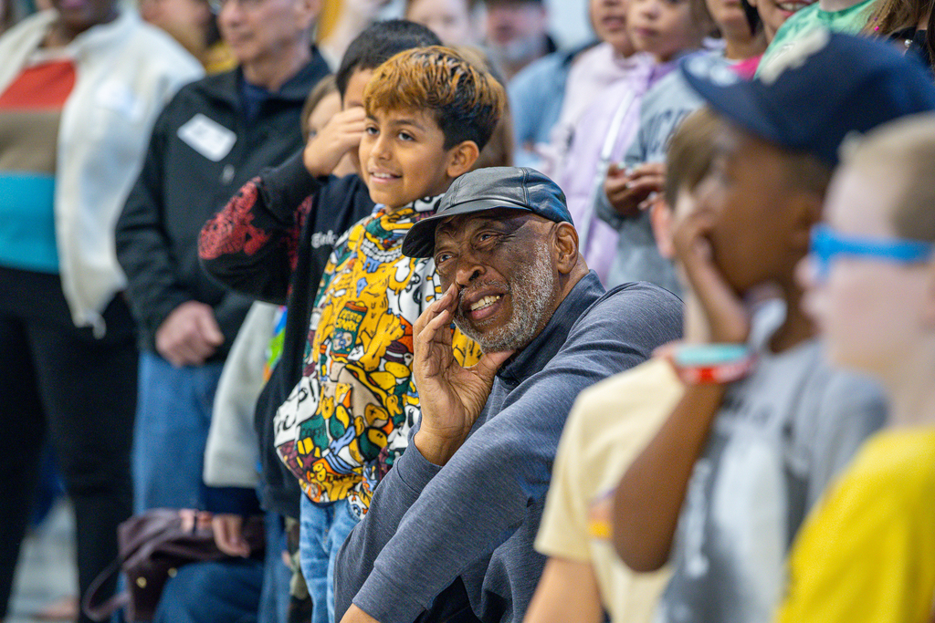 Larry Jagours seated in the gym at Slaughter looks up and smiles
